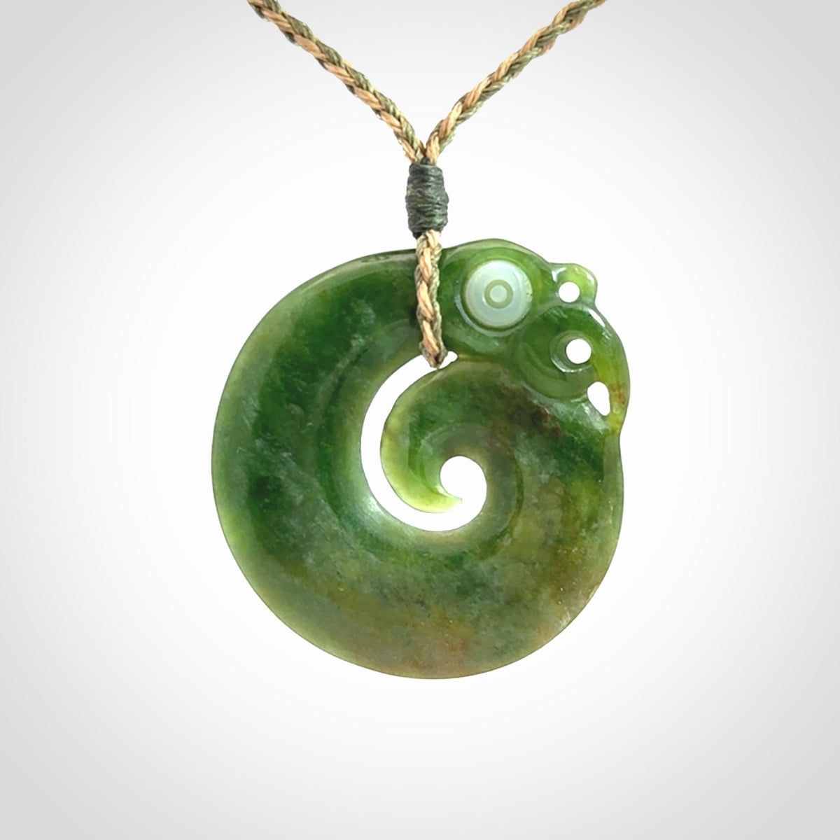 New Zealand Koru Manaia. Hand carved koropepe pendant. Made in New Zealand. Real Jade, pounamu.