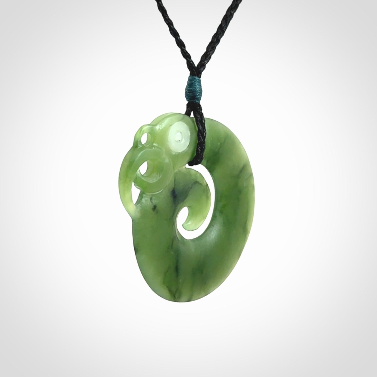 New Zealand Koru Manaia. Hand carved koropepe pendant. Made in New Zealand. Real Jade, pounamu.