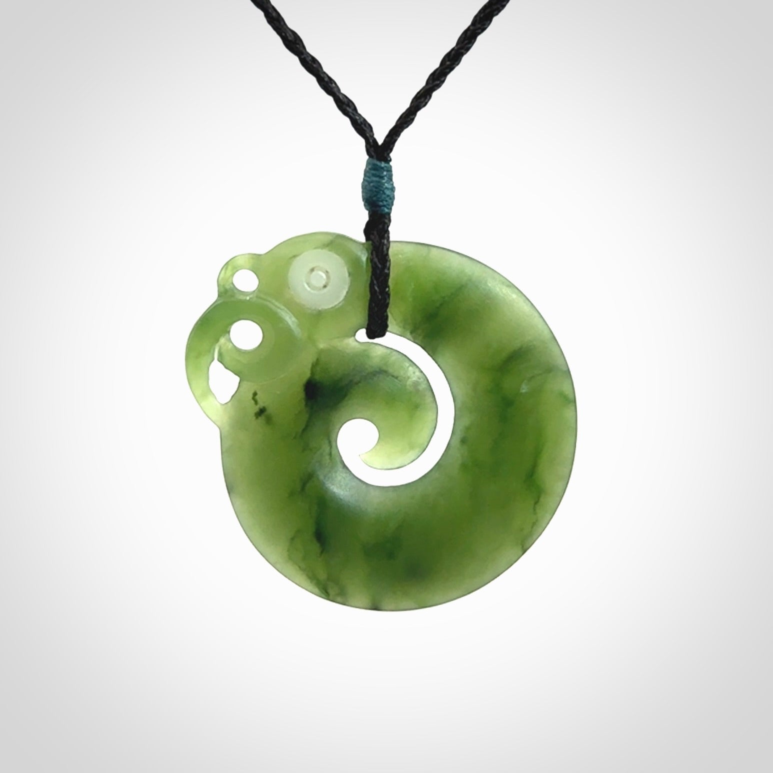 New Zealand Koru Manaia. Hand carved koropepe pendant. Made in New Zealand. Real Jade, pounamu.