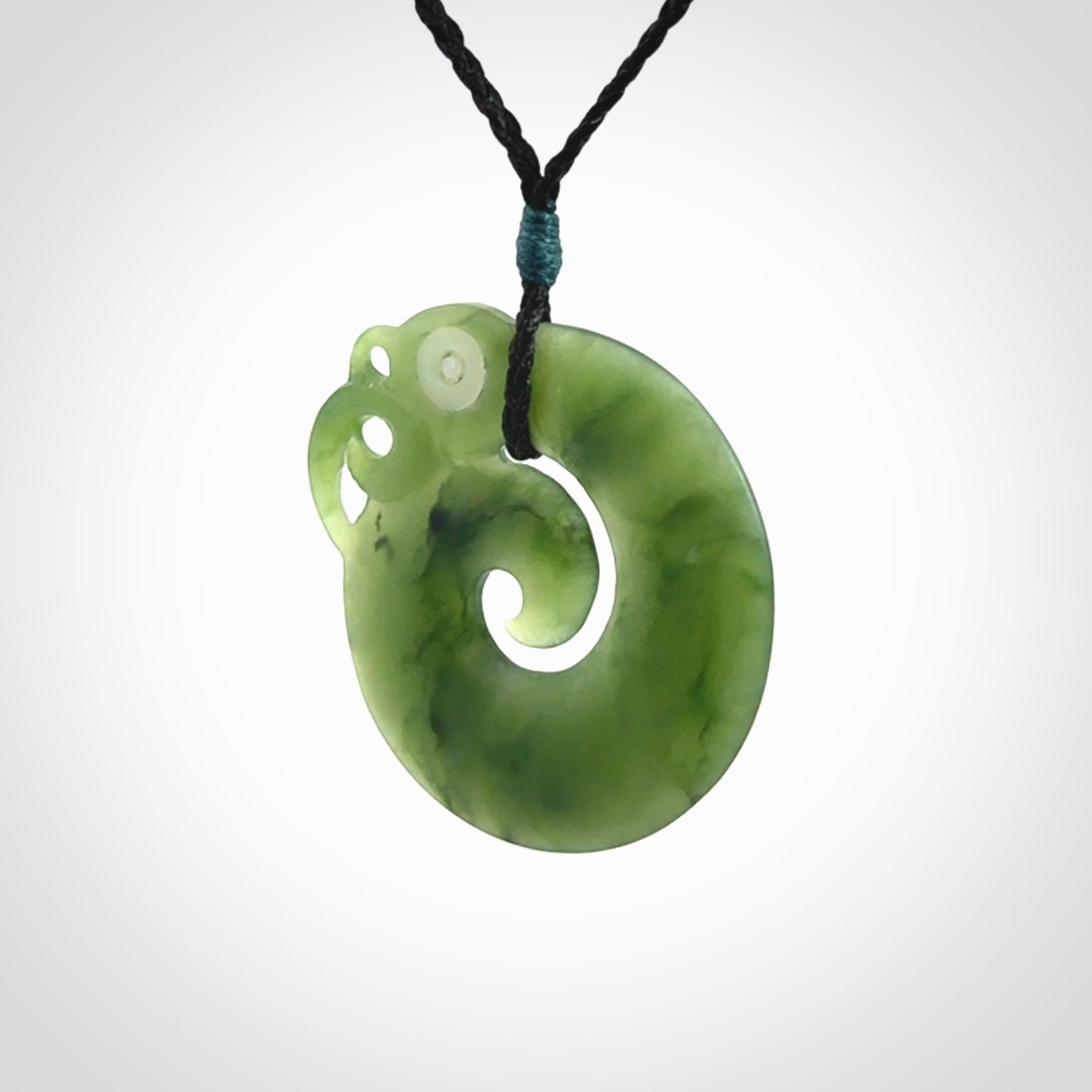 New Zealand Koru Manaia. Hand carved koropepe pendant. Made in New Zealand. Real Jade, pounamu.