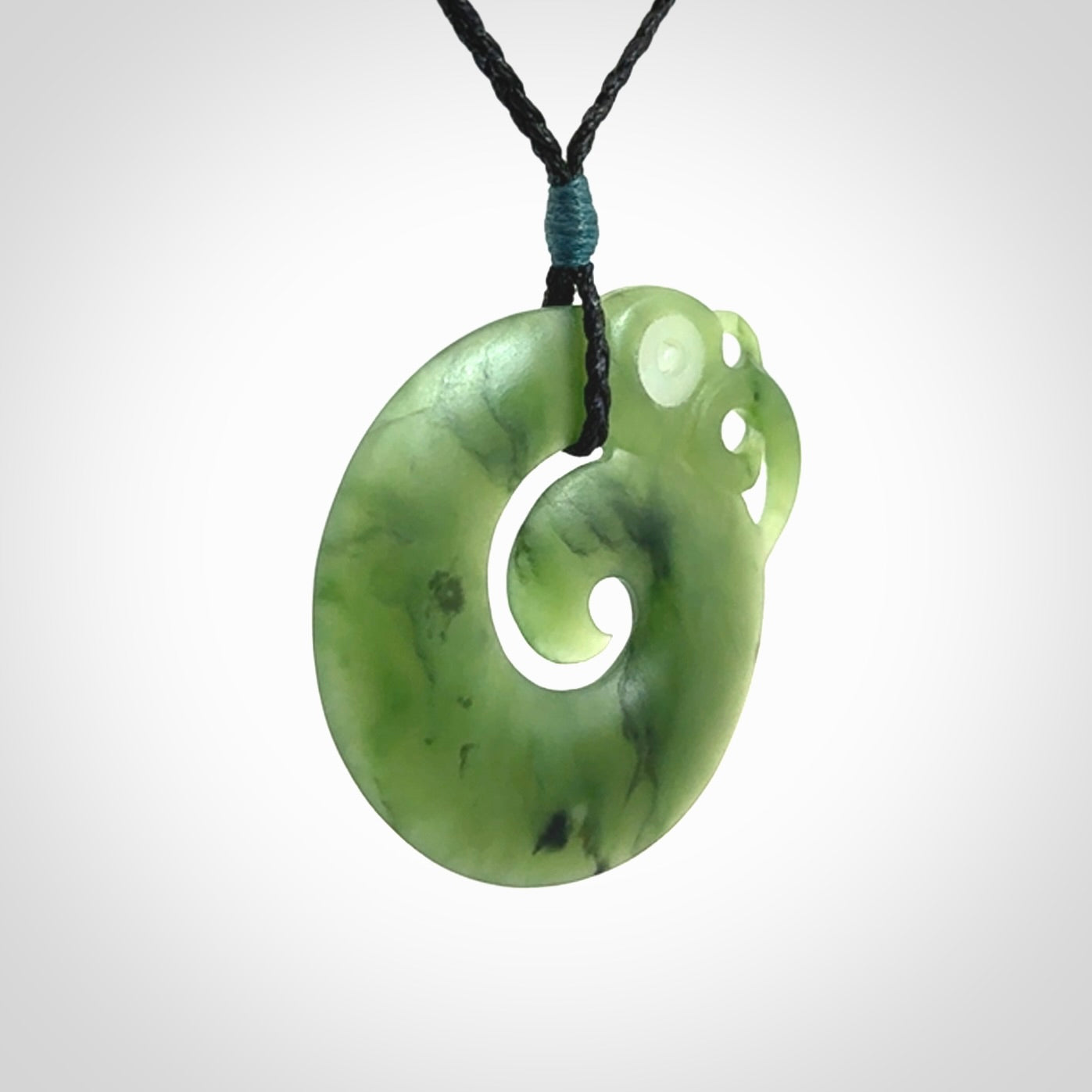 New Zealand Koru Manaia. Hand carved koropepe pendant. Made in New Zealand. Real Jade, pounamu.