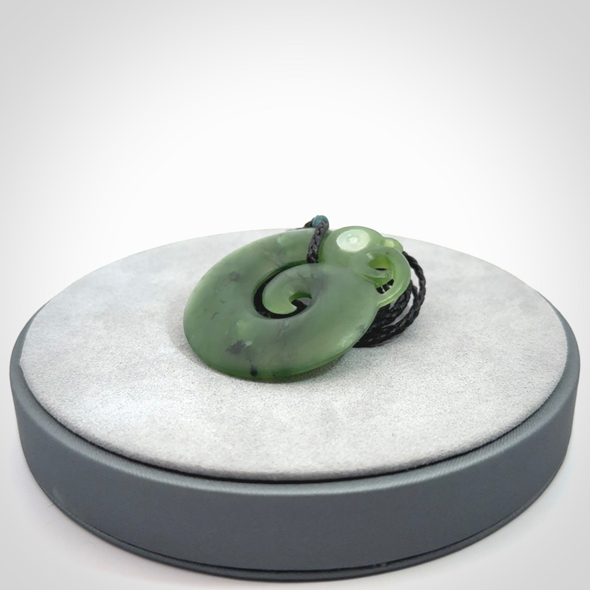 New Zealand Koru Manaia. Hand carved koropepe pendant. Made in New Zealand. Real Jade, pounamu.