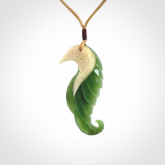 Hand carved jade and bone bird pendant