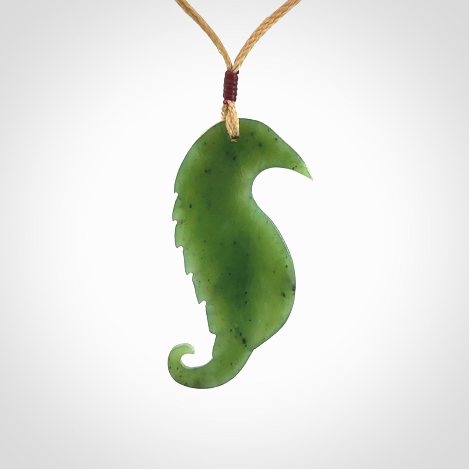 Hand carved jade and bone bird pendant