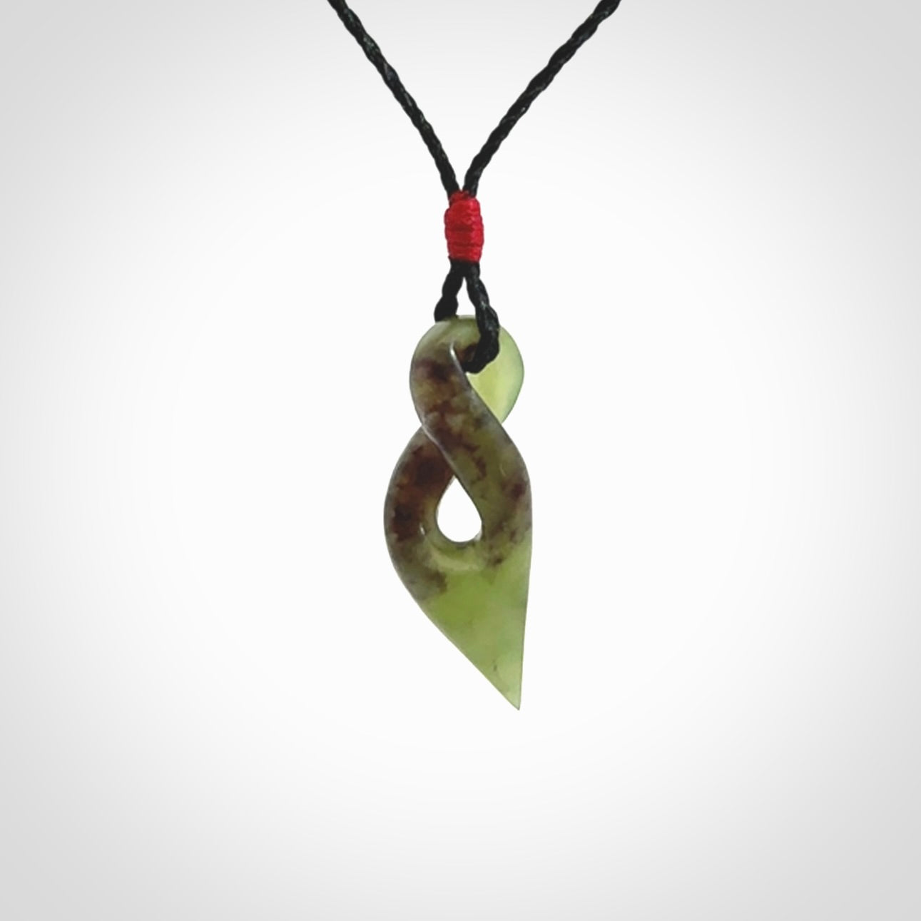 A Fine Twist Pendant, Carved in Totoweka Jade