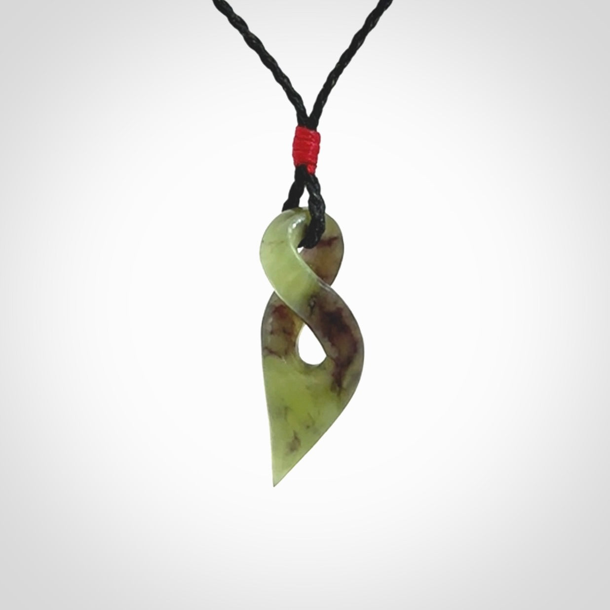 A Fine Twist Pendant, Carved in Totoweka Jade