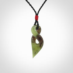 A Fine Twist Pendant, Carved in Totoweka Jade