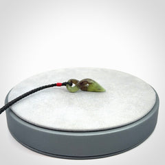 A Fine Twist Pendant, Carved in Totoweka Jade
