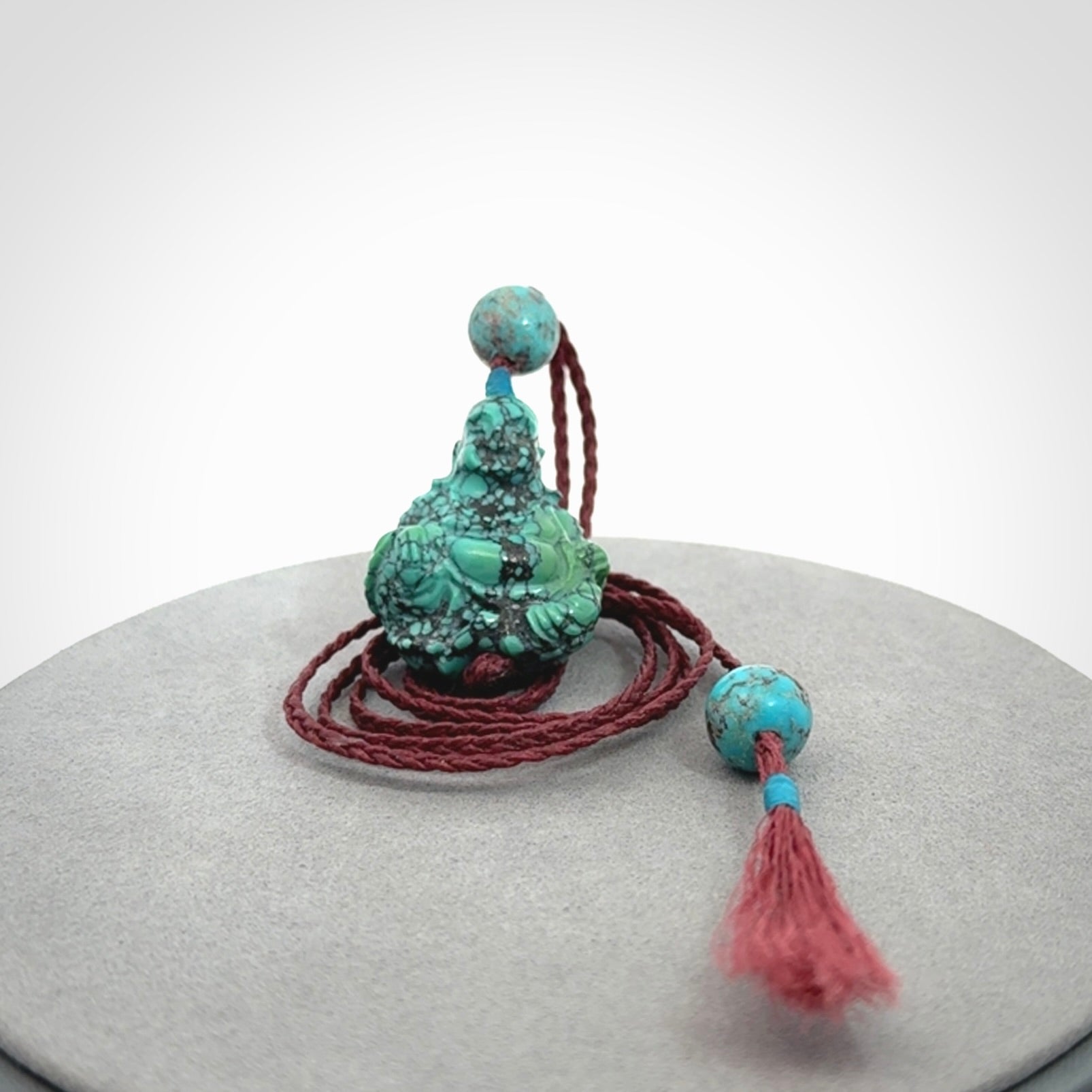 Hand Carved Meditating Buddha Pendant Carved in Turquoise