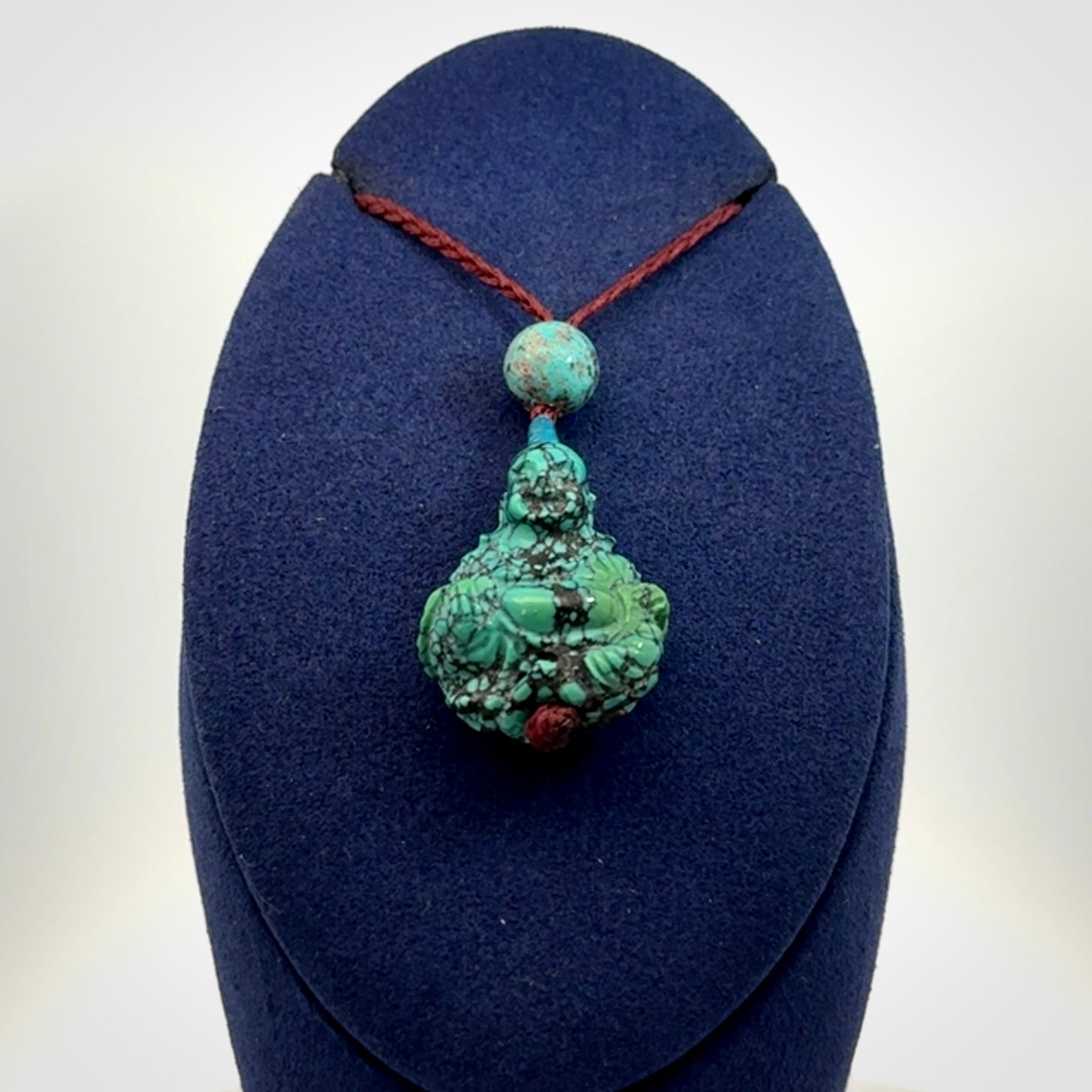 Hand Carved Meditating Buddha Pendant Carved in Turquoise