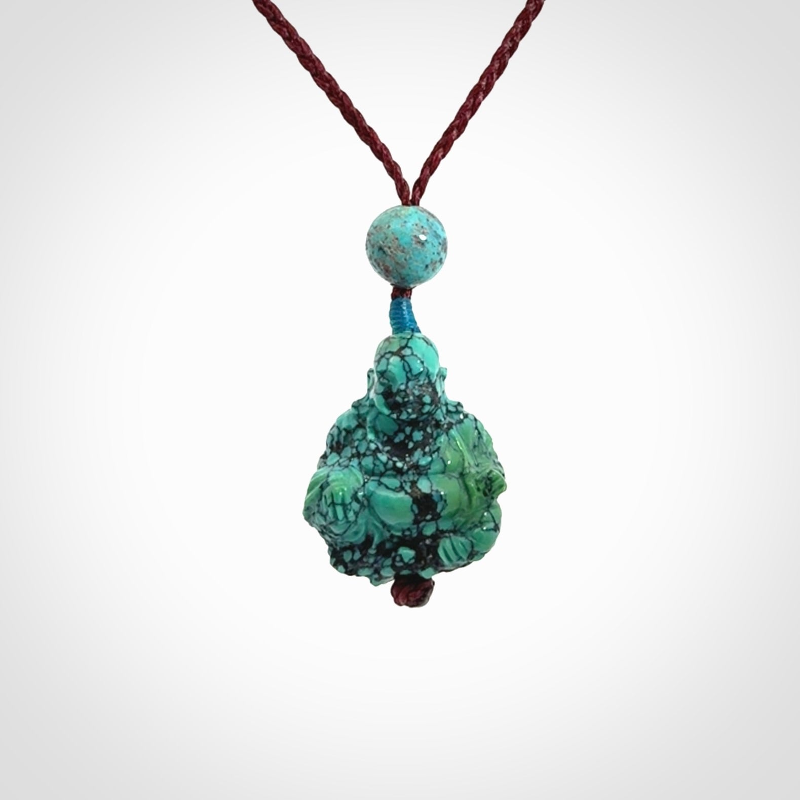 Hand Carved Meditating Buddha Pendant Carved in Turquoise