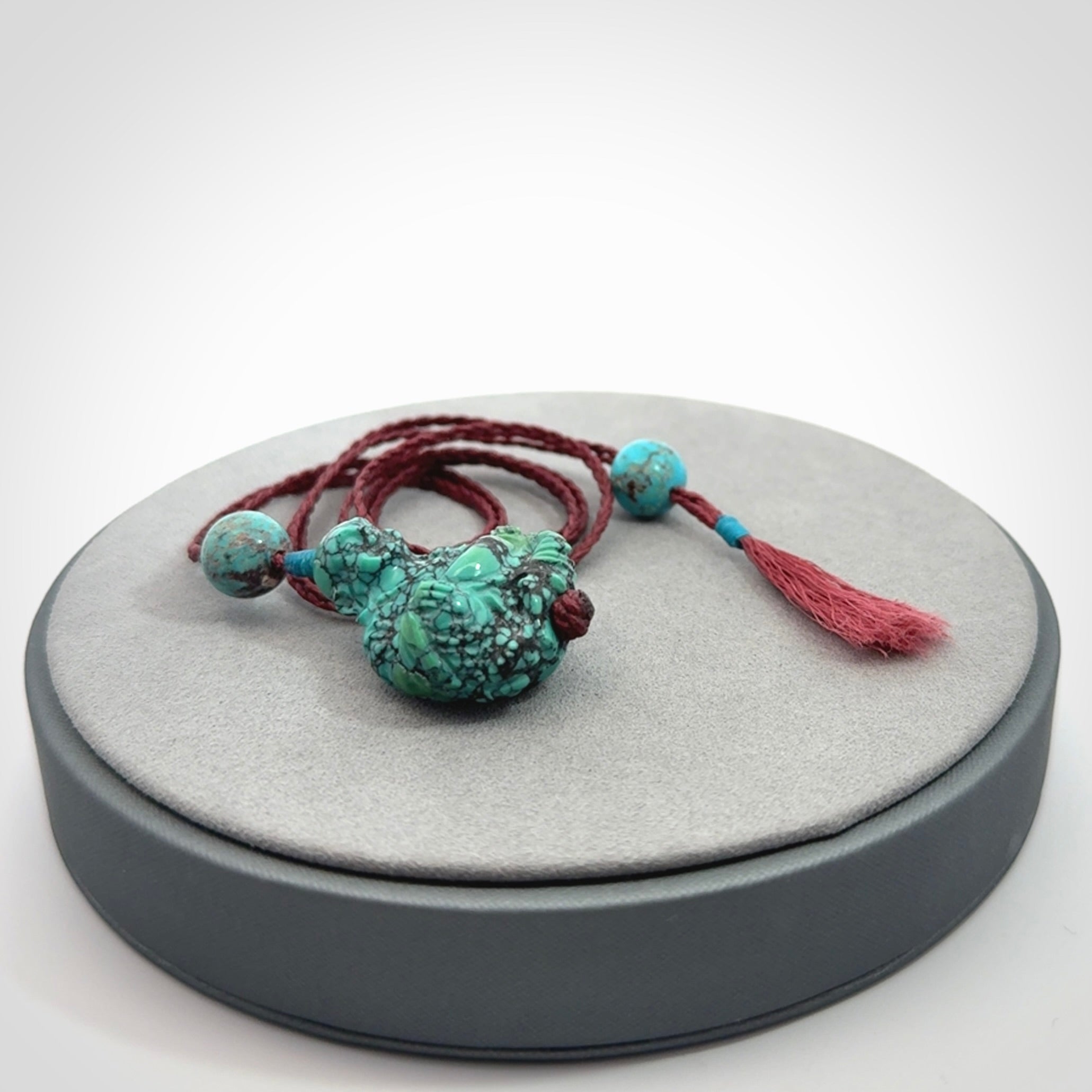 Hand Carved Meditating Buddha Pendant Carved in Turquoise