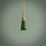 Hand carved jade toki by Ric Moor. Made in New Zealand by NZ Pacific. Hand carved Toki pendants crafted from beautiful New Zealand Pounamu, Jade. We deliver these with Express Courier, on adjustable cords.