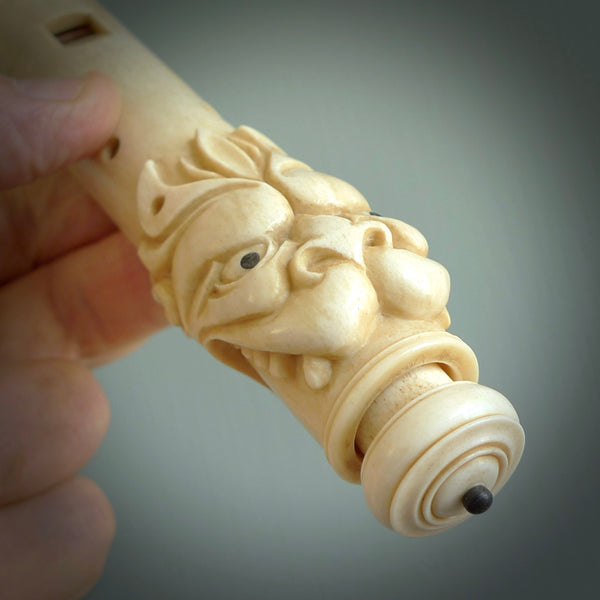A contemporary hand carved flute. This piece is made from bone and is a fully functioning musical instrument and can be played. Beautiful art hand made by Yuri Terenyi. Flute with Dragons head.