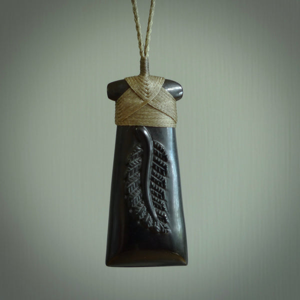 A gorgeous black jade toki pendant, carved with New Zealand's silver fern in relief. This is a pendant we designed for the Rugby World Cup. It is the fern that our national team the All Blacks wear on their jerseys, and the black is the colour of their team uniform. A fantastic and visually striking pendant, designed and carved by NZ Pacific.