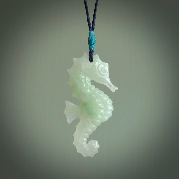 A hand carved Jadeite seahorse pendant. We have carved this from beautiful jadeite and we bind them with our hand-plaited cords. The cords are a waxed polyester so they are durable and strong. We ship these worldwide with express courier anywhere in the world.