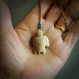 This is a beautiful hand carved woolly mammoth tusk turtle pendant. A really cool piece that is made from this rare and beautiful material. The mammoth has a very distinctive grain and each piece is different. We ship this worldwide and the cost of shipping is included in the price.