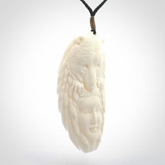 Hand carved woman with bear pendant