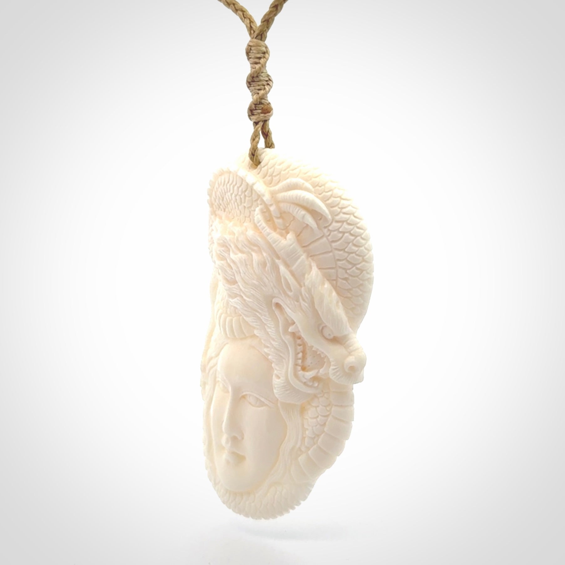 Hand carved bone woman dragon pendant