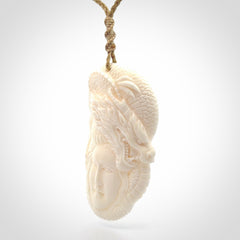 Hand carved bone woman dragon pendant