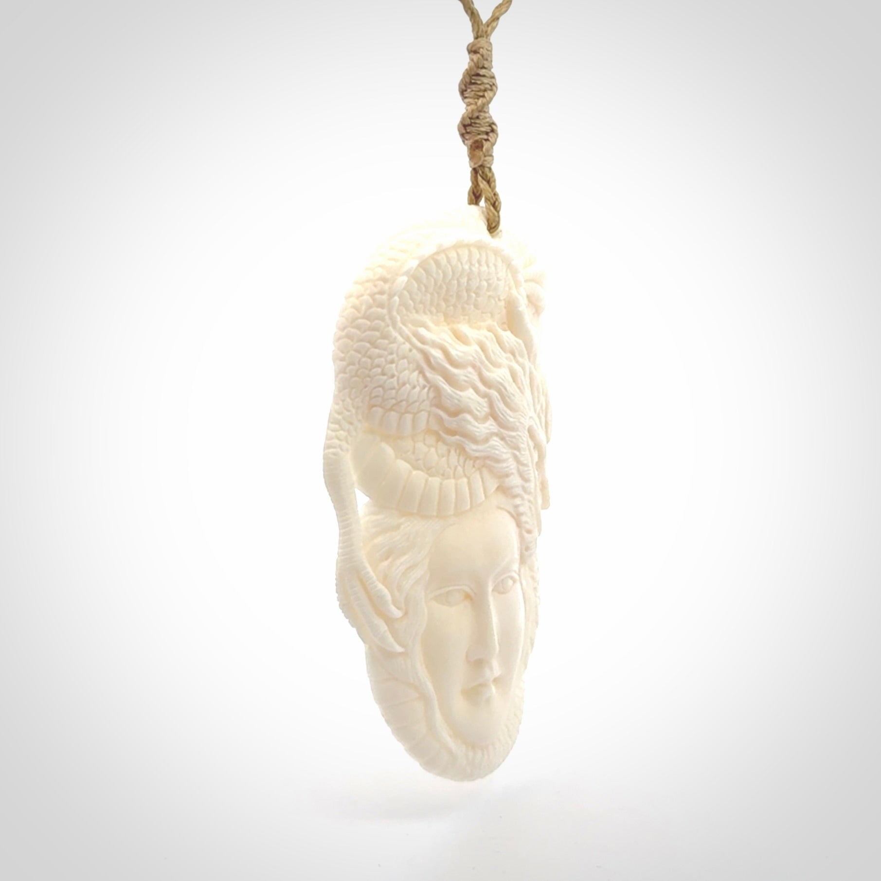 Hand carved bone woman dragon pendant