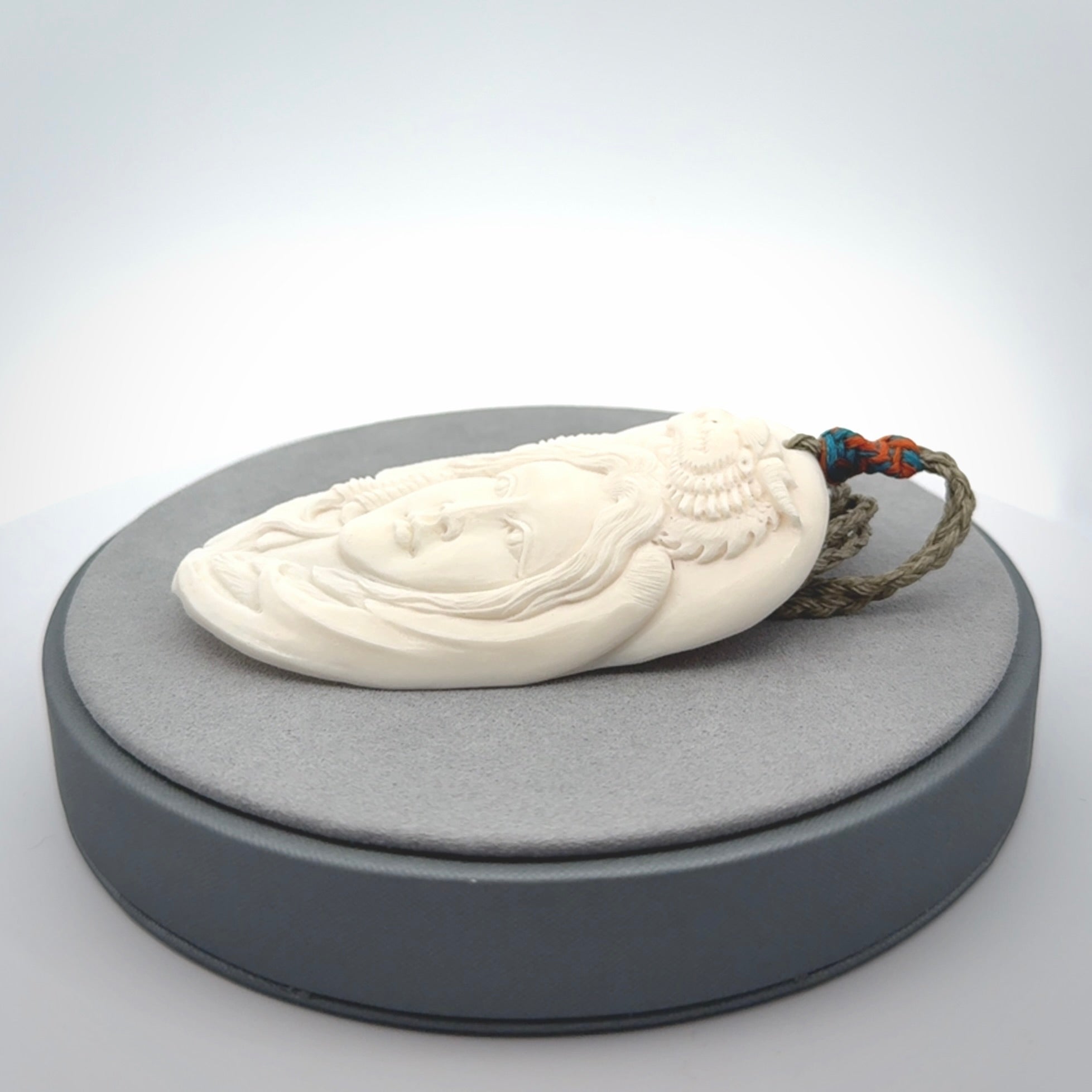 Hand carved bone dragon woman pendant