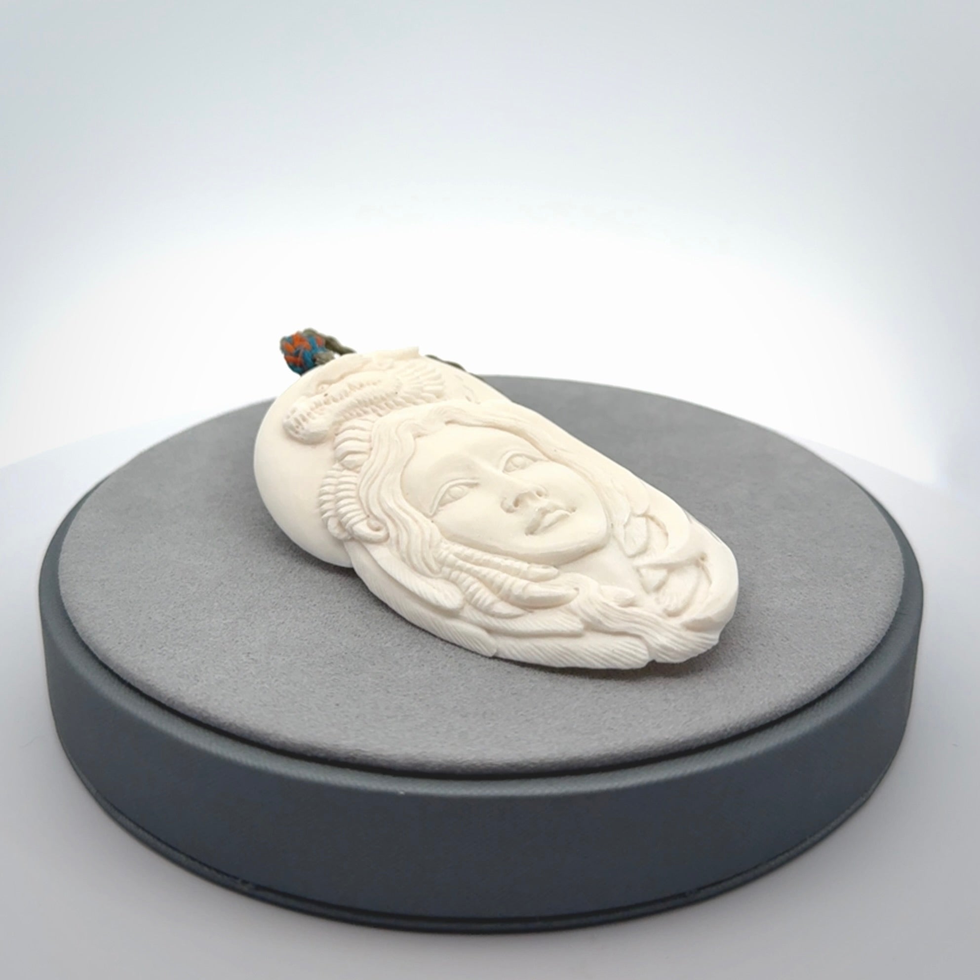 Hand carved bone dragon woman pendant