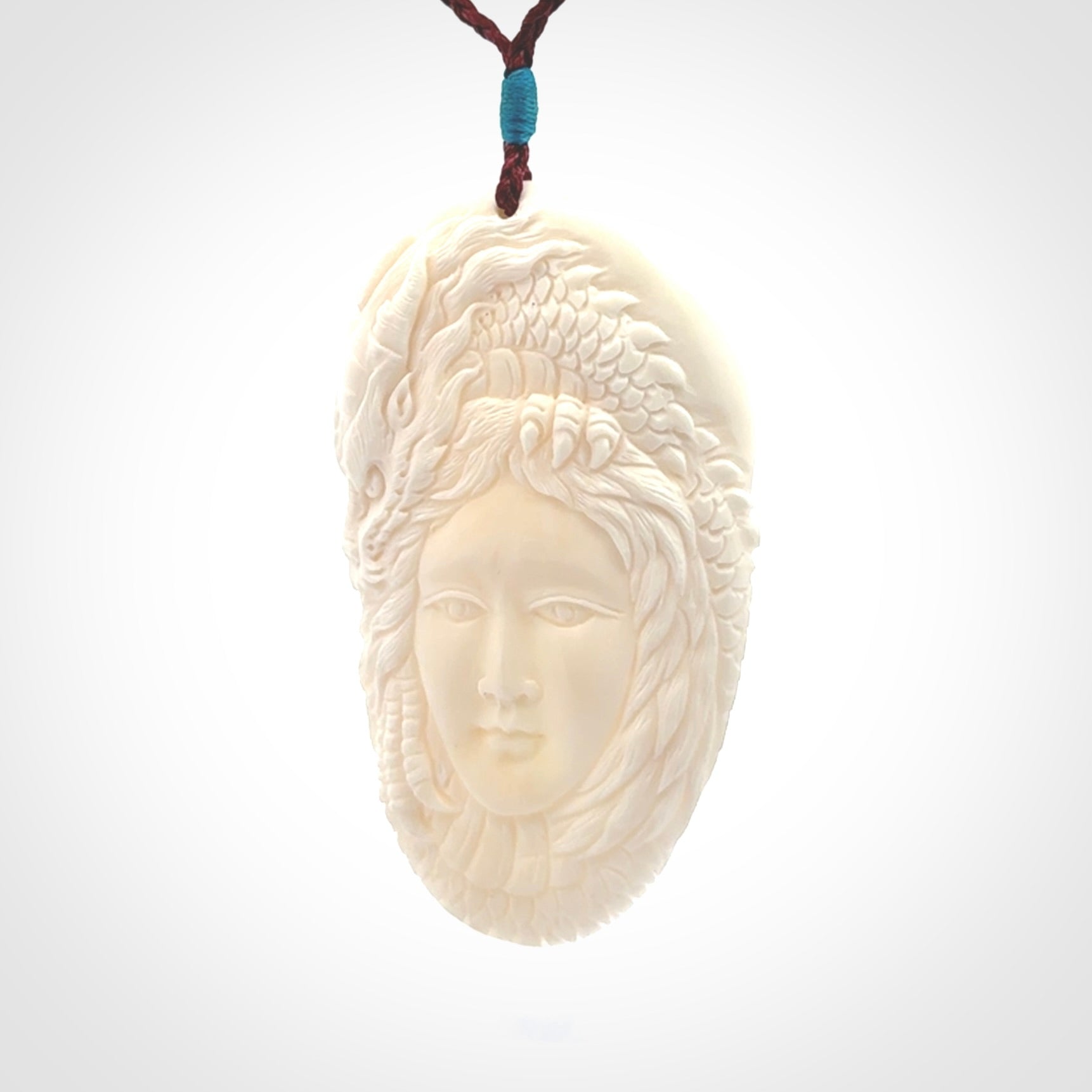 Hand carved bone dragon woman pendant
