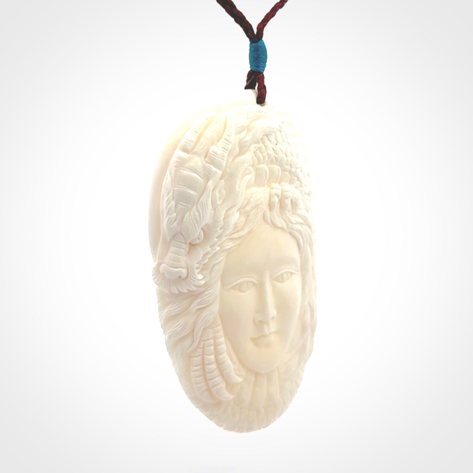 Hand carved bone dragon woman pendant