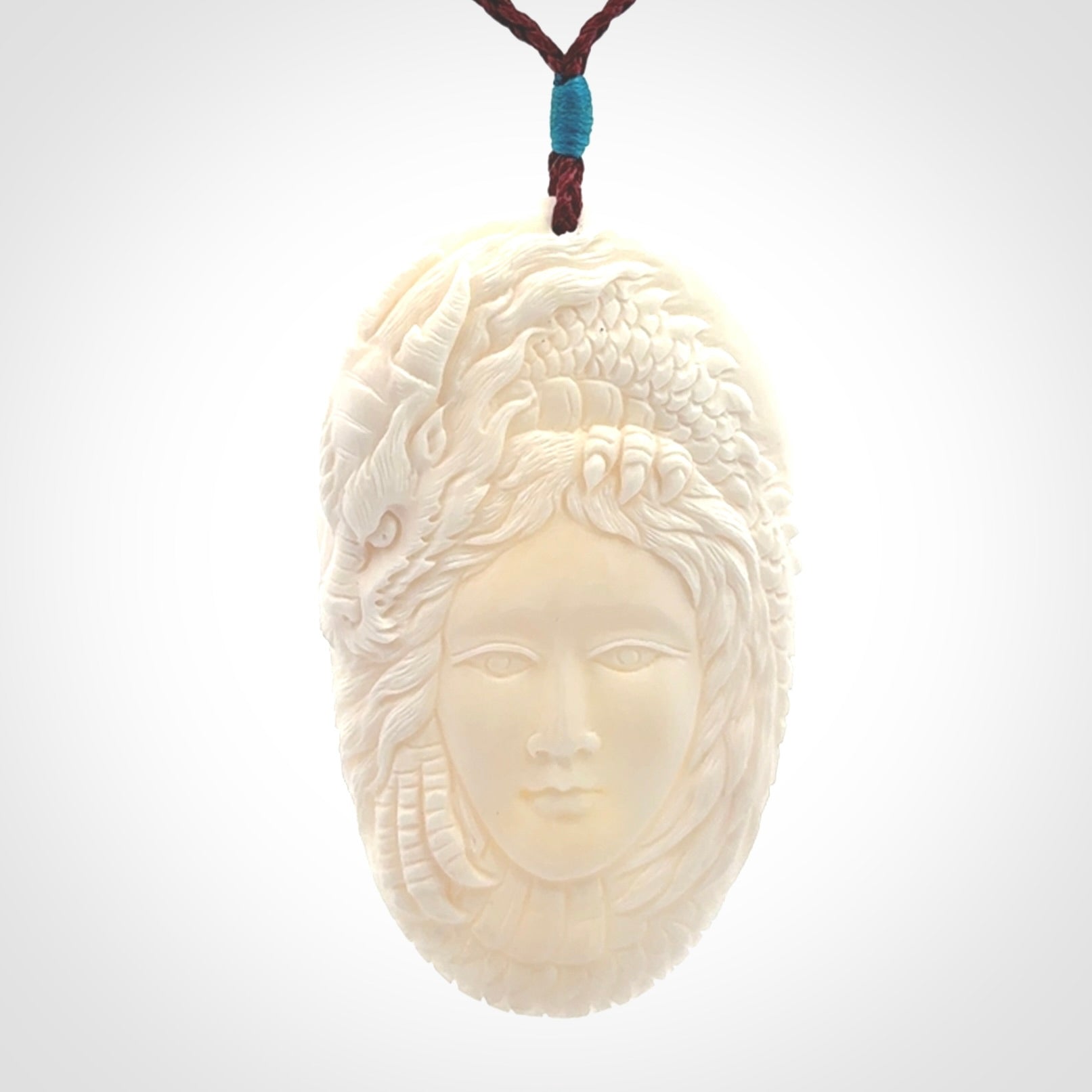 Hand carved bone dragon woman pendant