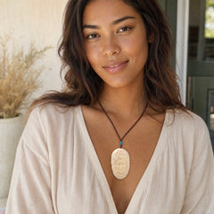 Woman wearing dragon pendant