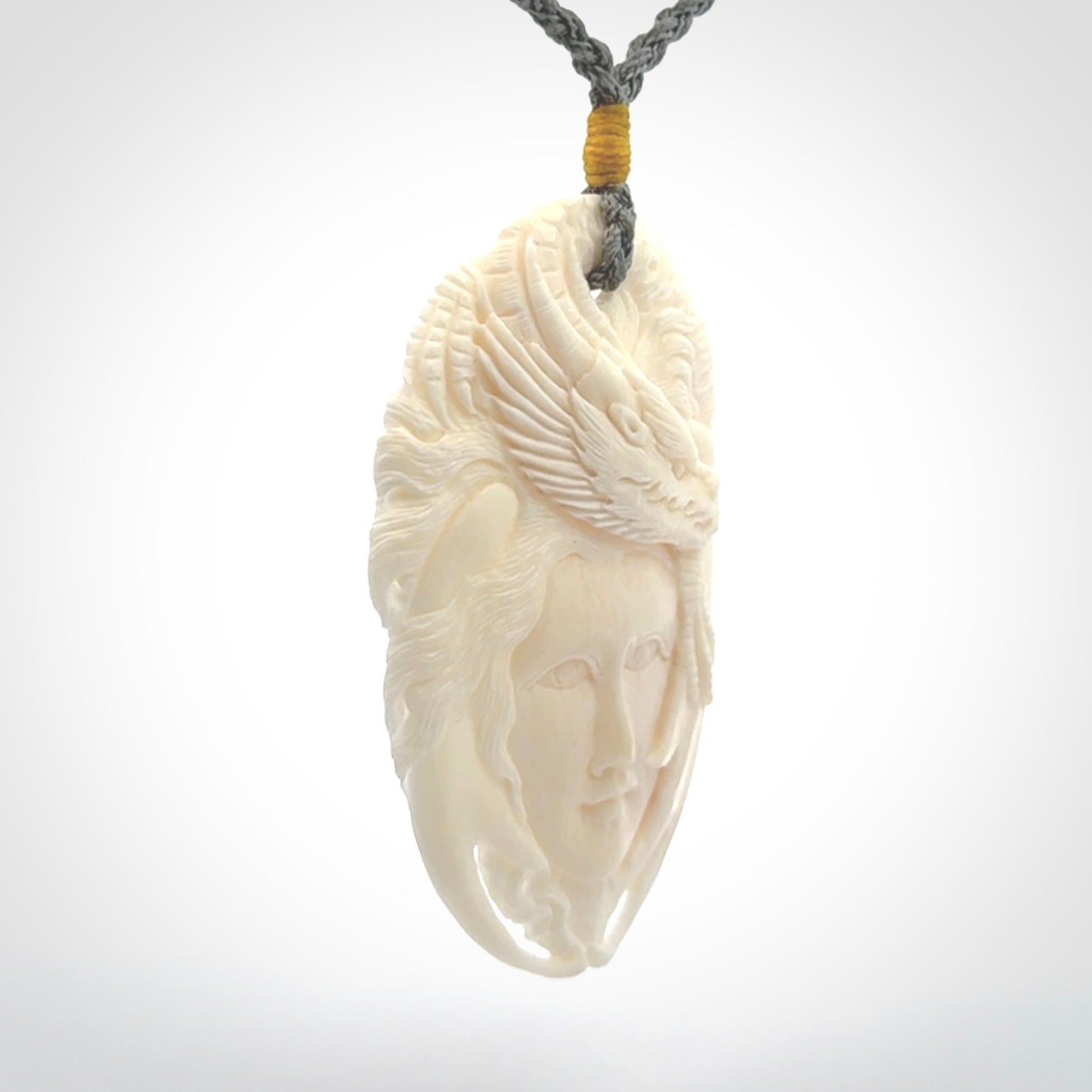 Hand carved bone dragon woman pendant