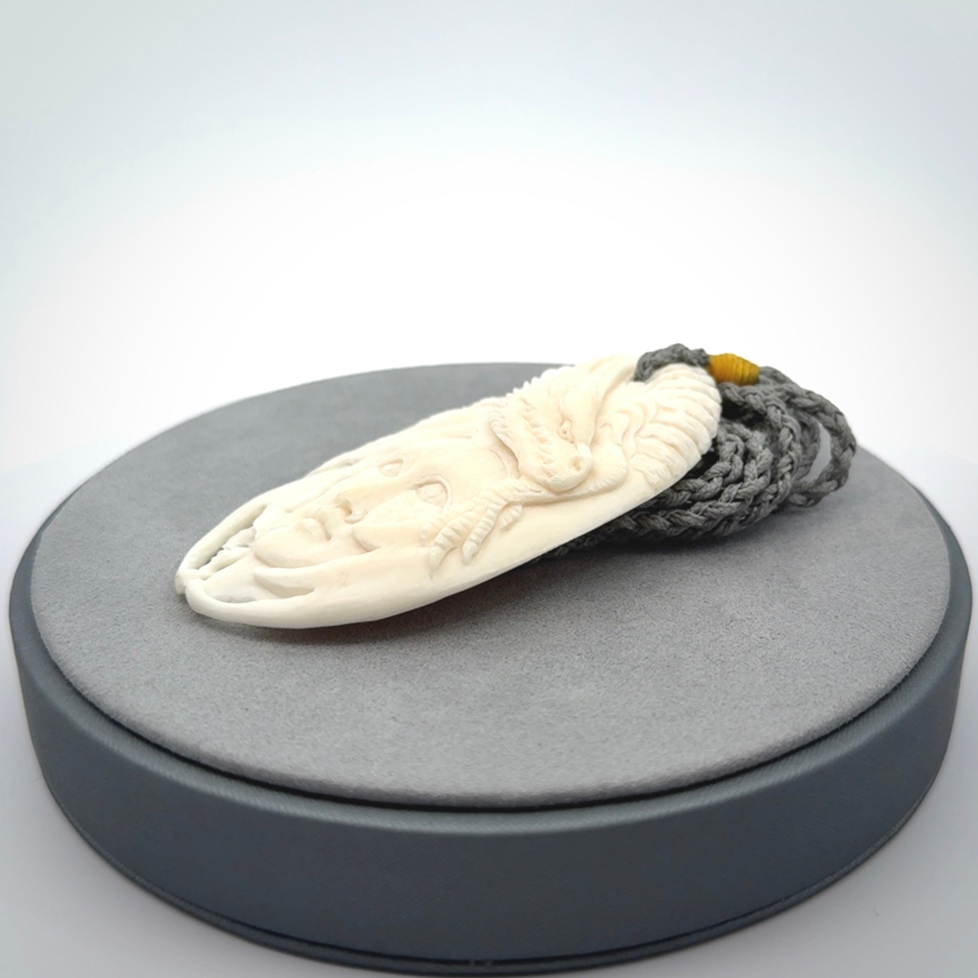 Hand carved bone dragon woman pendant