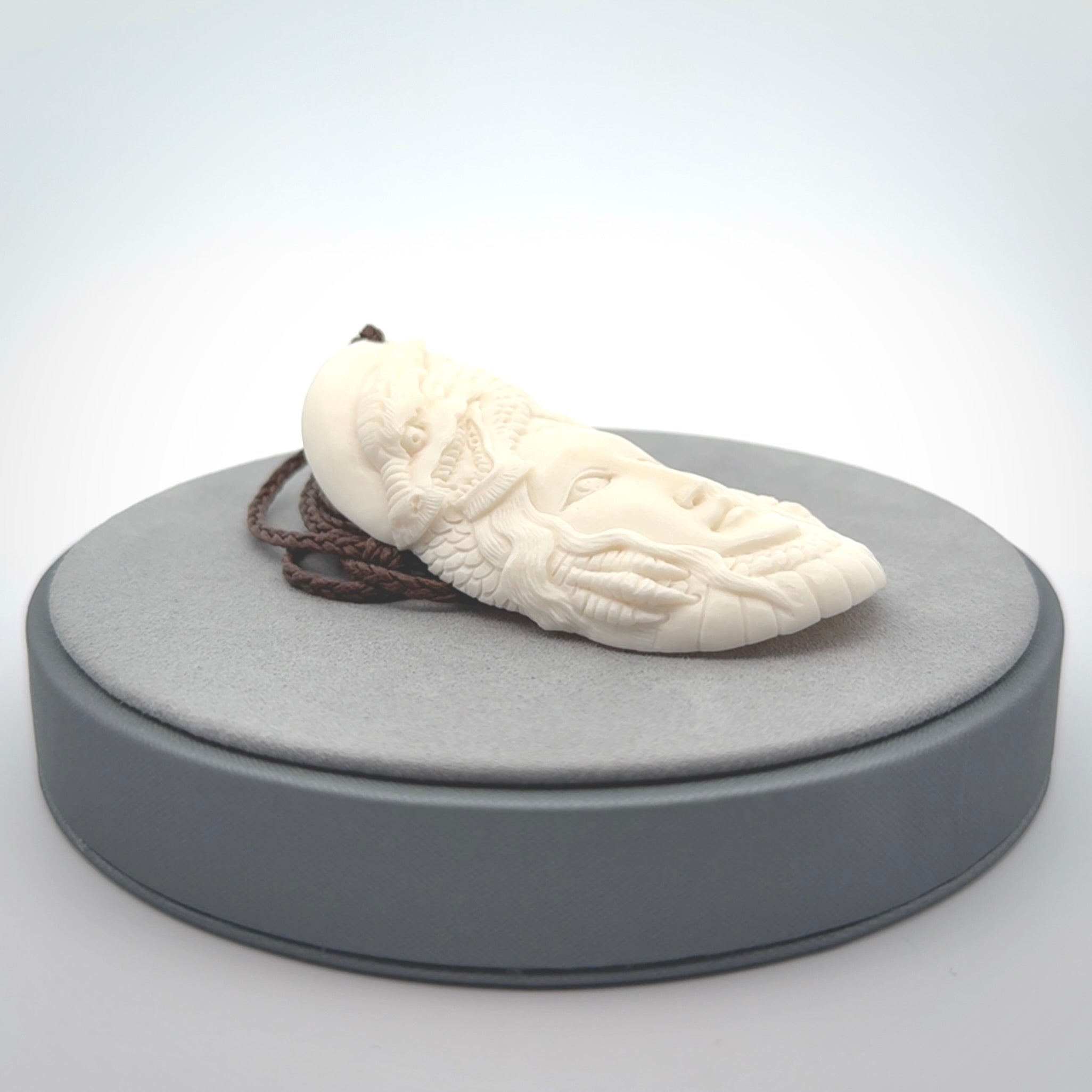 Hand carved bone dragon woman pendant