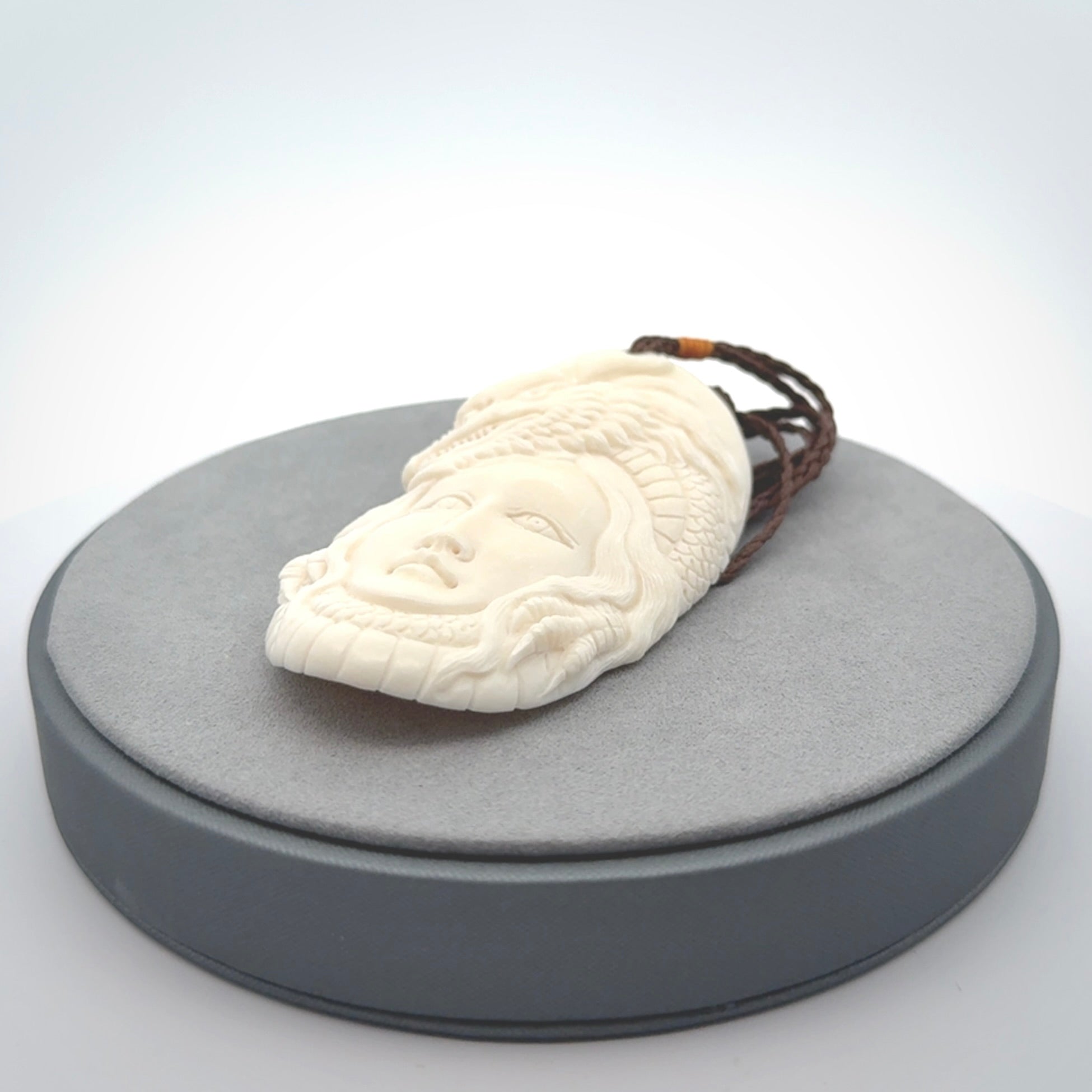 Hand carved bone dragon woman pendant