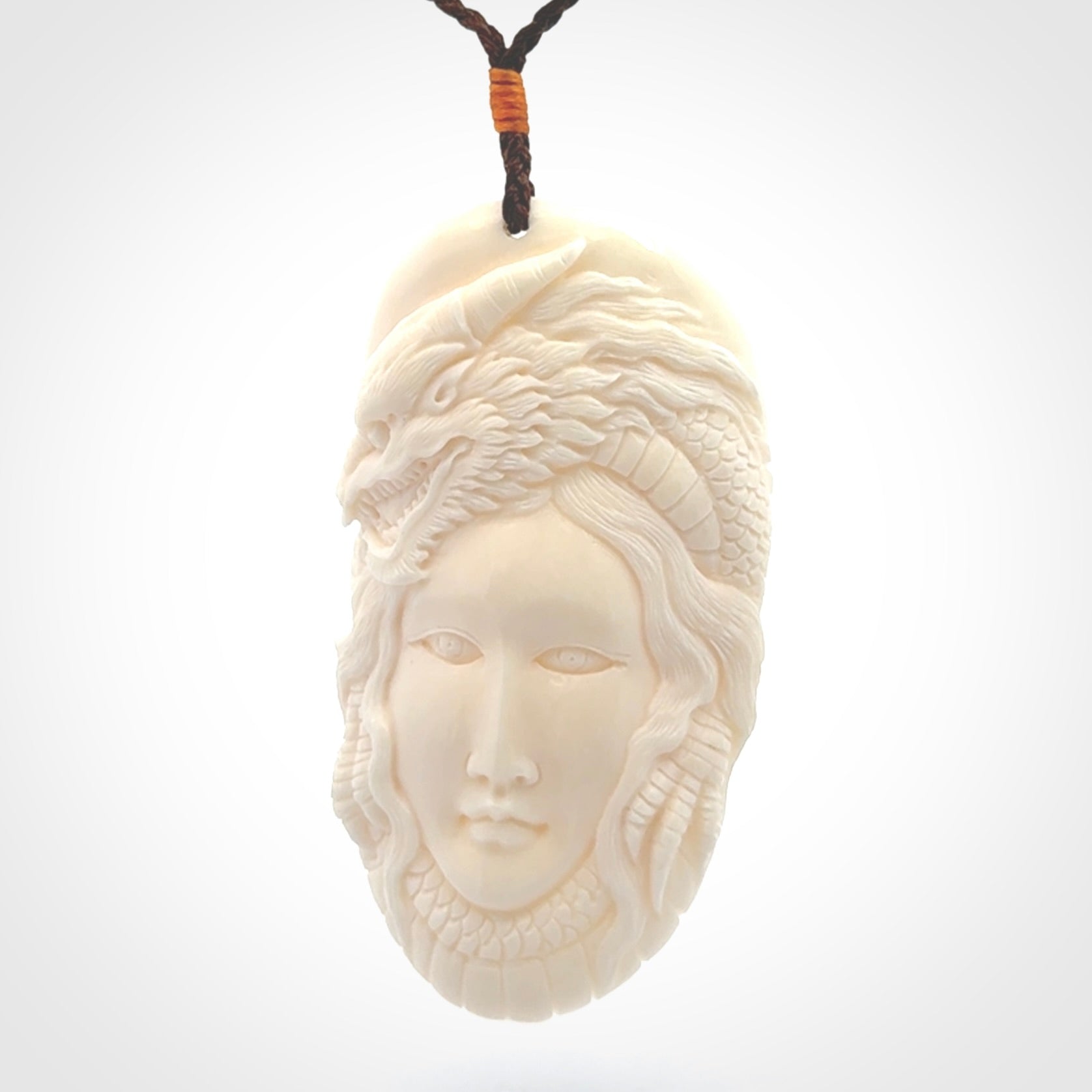 Hand carved bone dragon woman pendant