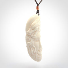 Hand carved bone dragon woman pendant