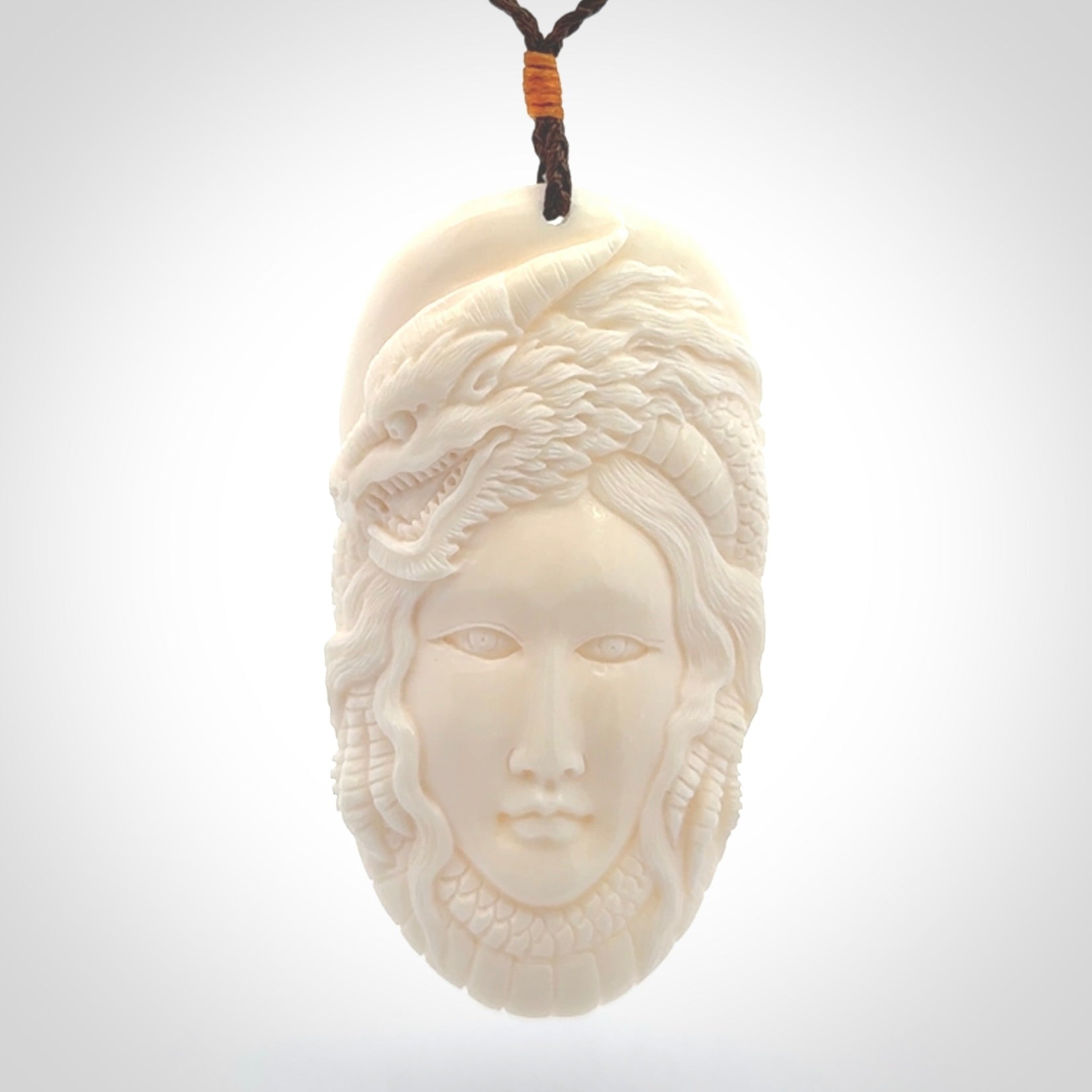 Hand carved bone dragon woman pendant