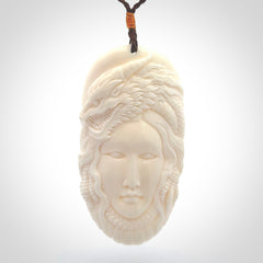 Hand carved bone dragon woman pendant
