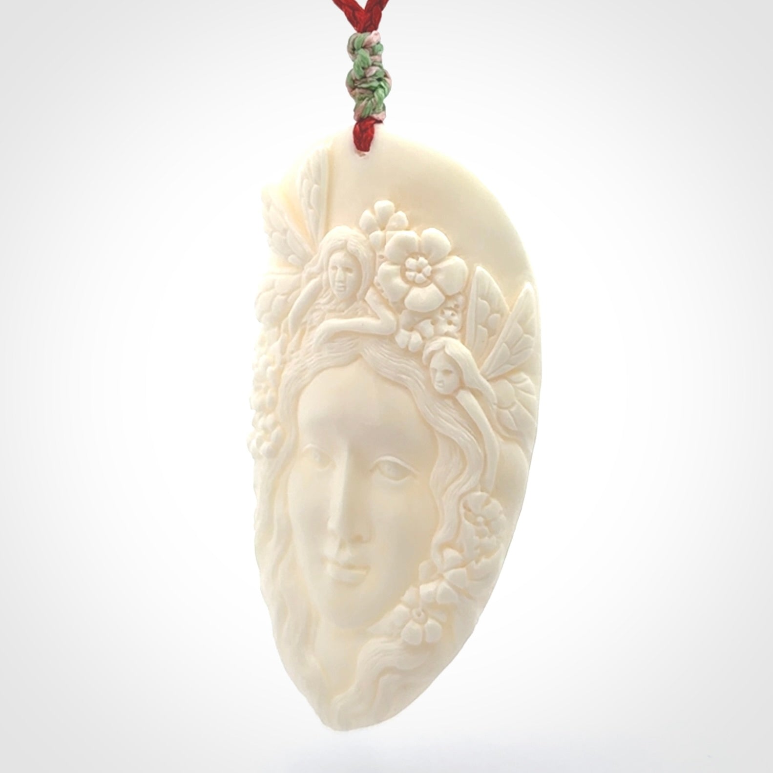 Fanciful and Creative Bone Art to Wear! Bone woman with fairies pendant