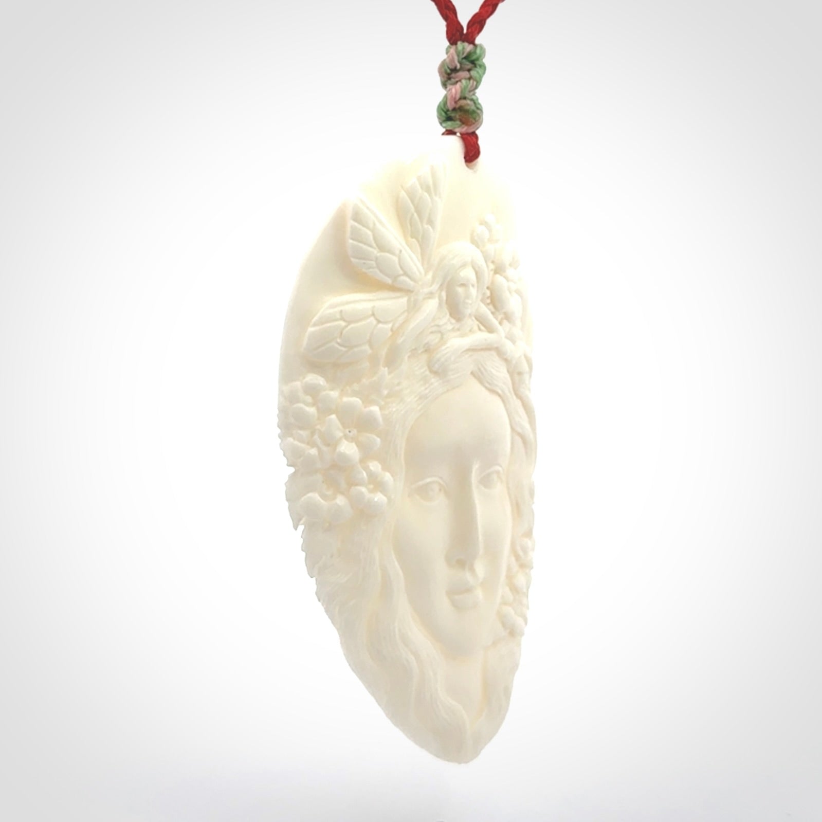 Fanciful and Creative Bone Art to Wear! Bone woman with fairies pendant