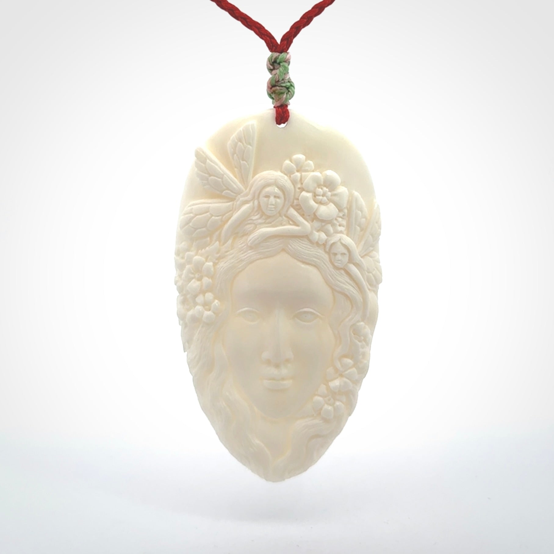 Fanciful and Creative Bone Art to Wear! Bone woman with fairies pendant