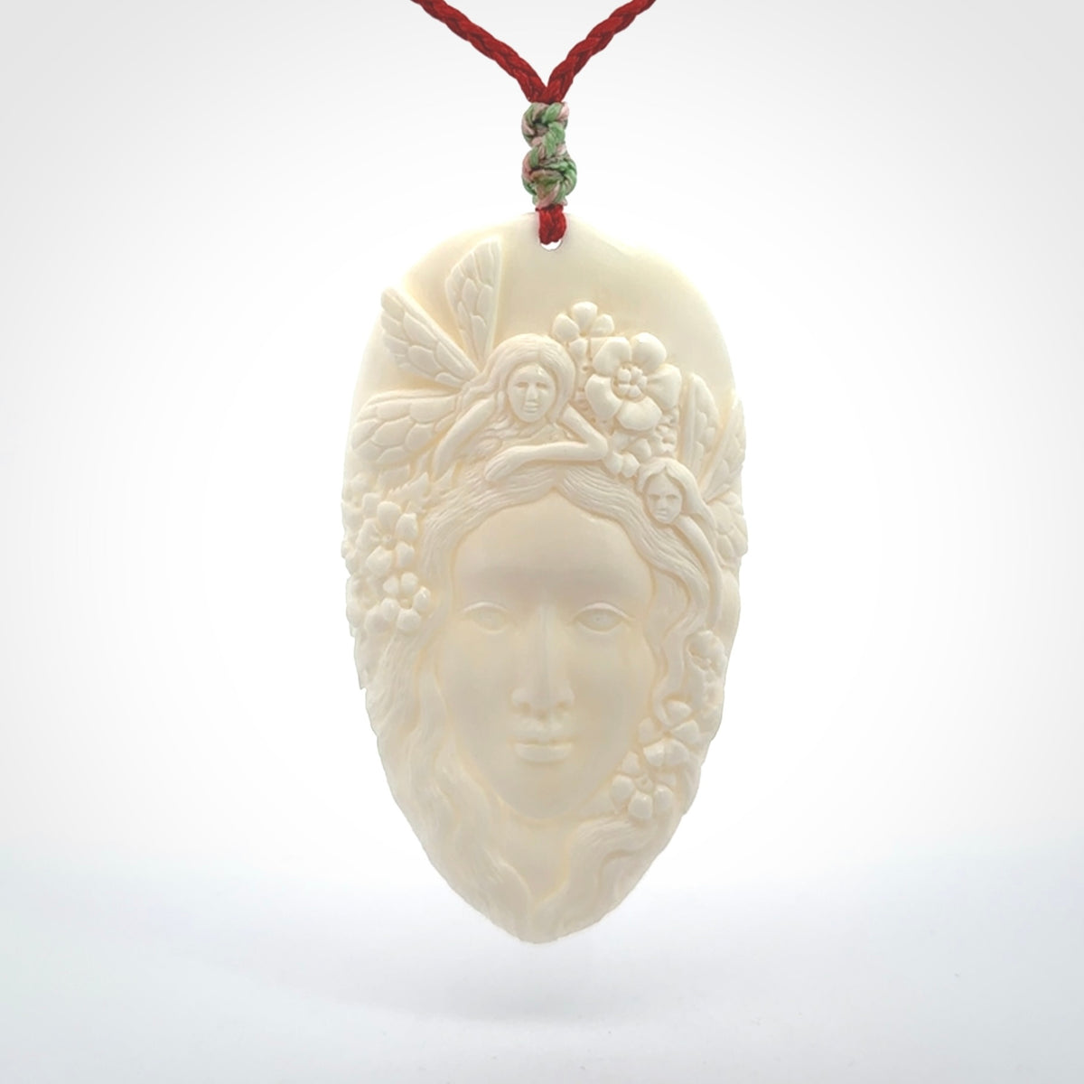 Fanciful and Creative Bone Art to Wear! Bone woman with fairies pendant