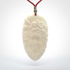 Fanciful and Creative Bone Art to Wear! Bone woman with fairies pendant