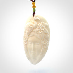 Hand Carved Woman with Peacock Pendant