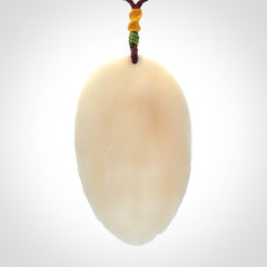 Hand Carved Woman with Peacock Pendant