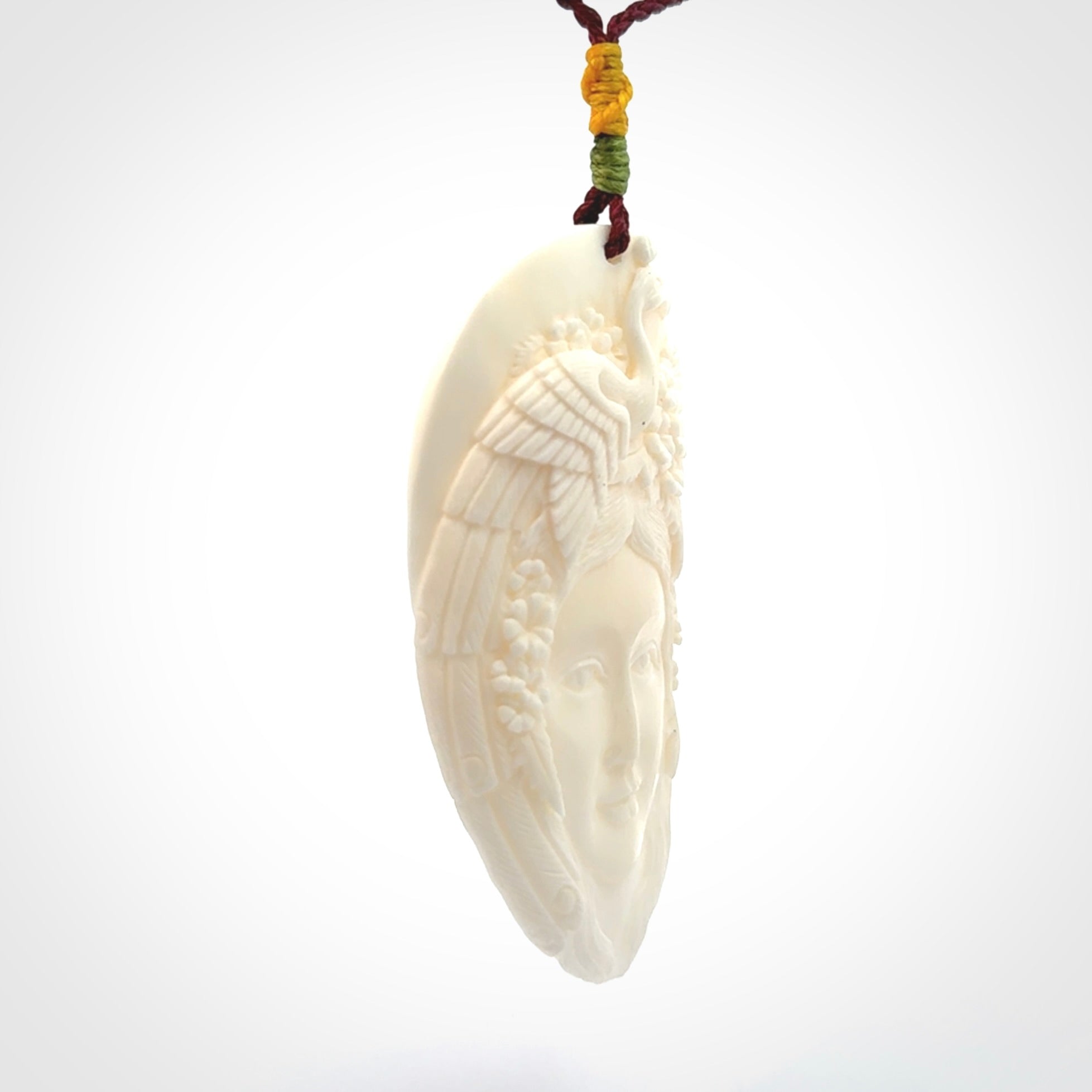 Hand Carved Woman with Peacock Pendant