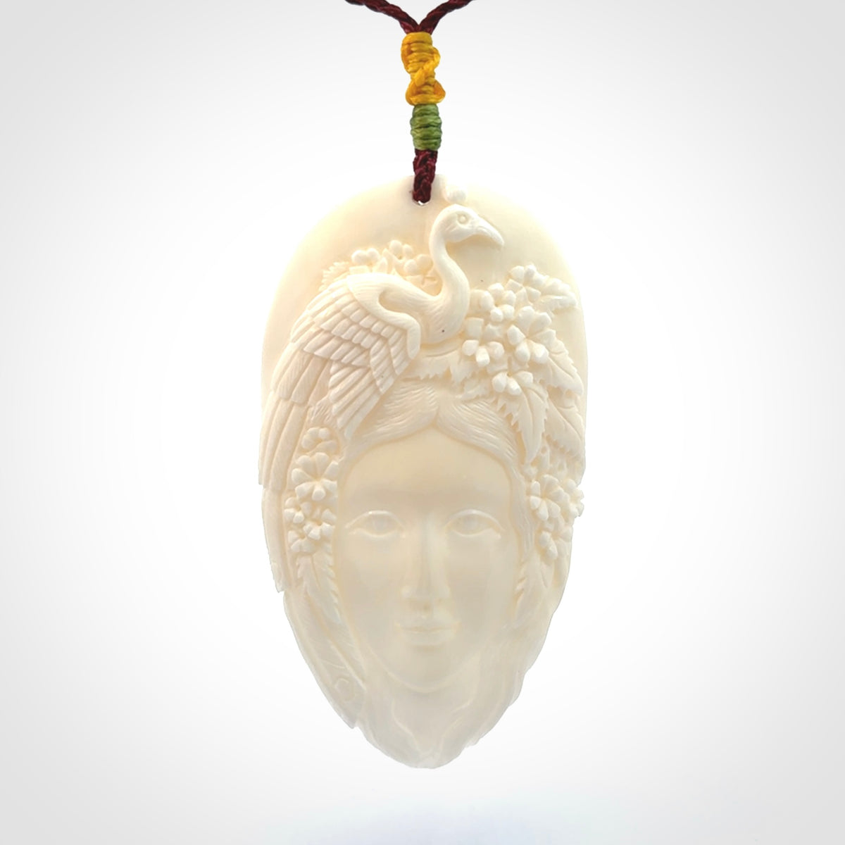 Hand Carved Woman with Peacock Pendant