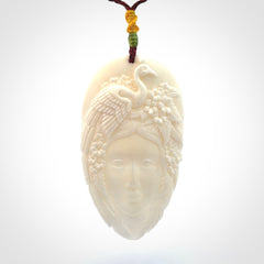 Hand Carved Woman with Peacock Pendant