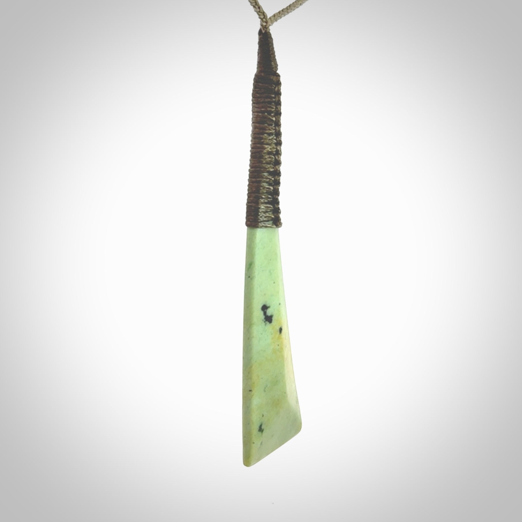 One only larger sized New Zealand jade drop pendant. Hand carved in New Zealand by Donna Summers, jade artist, for NZ Pacific. Provided with Khaki adjustable cord.